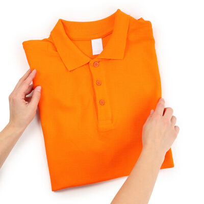 female-hands-hold-folded-t-shirt-isolated-on-whit-2022-01-11-22-04-18-utc